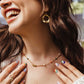 Song of Celebration Gold Feather Necklace