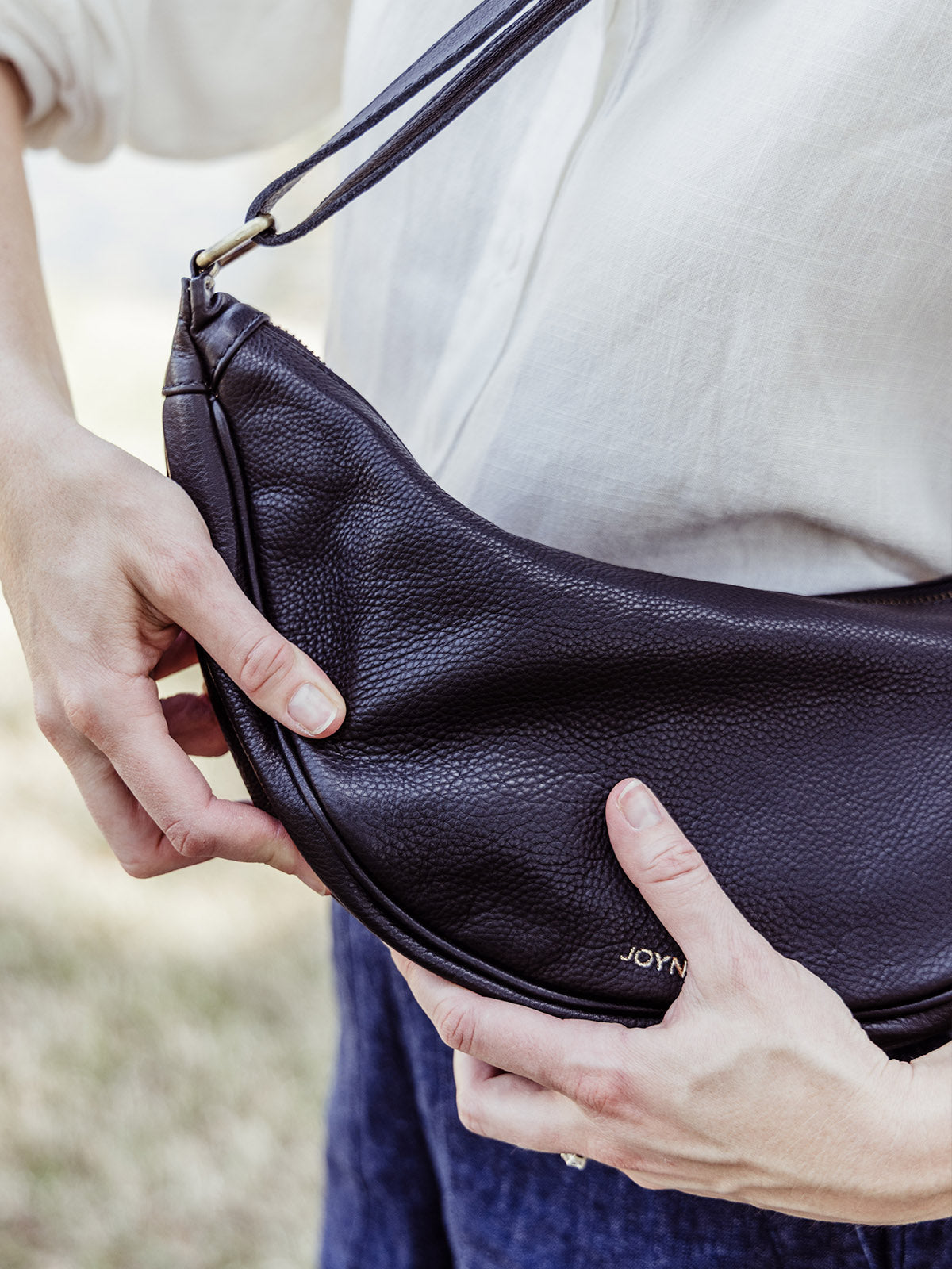 Black Leather Moon Sling Bag