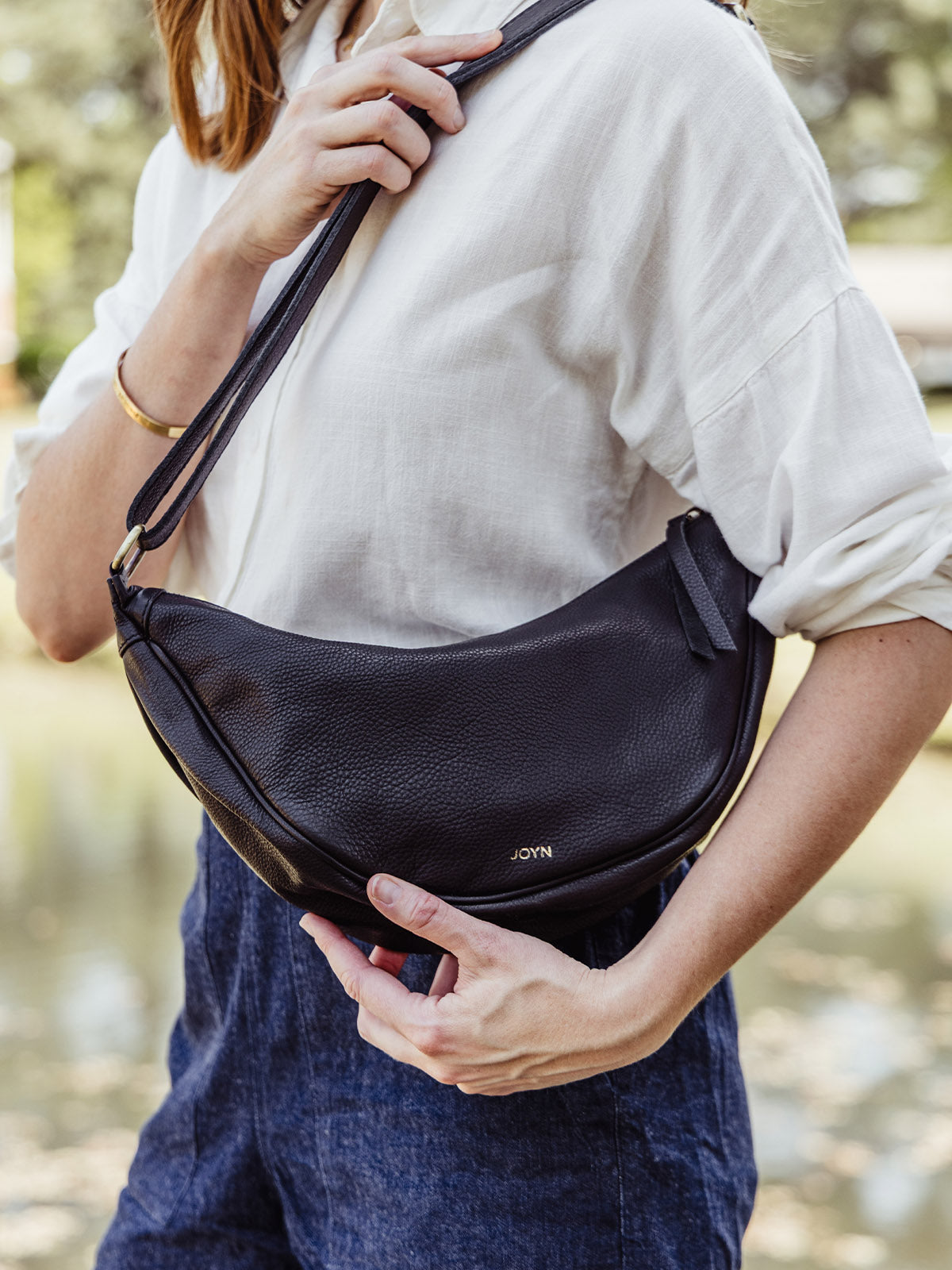 Black Leather Moon Sling Bag