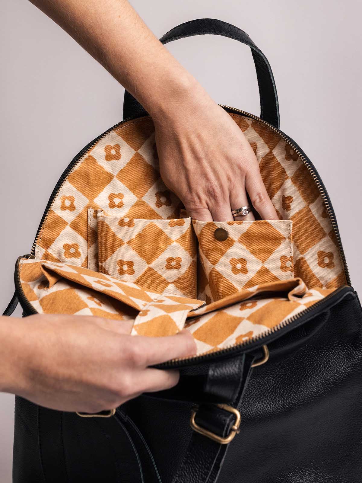Pebbled Black Leather Half-Moon Backpack