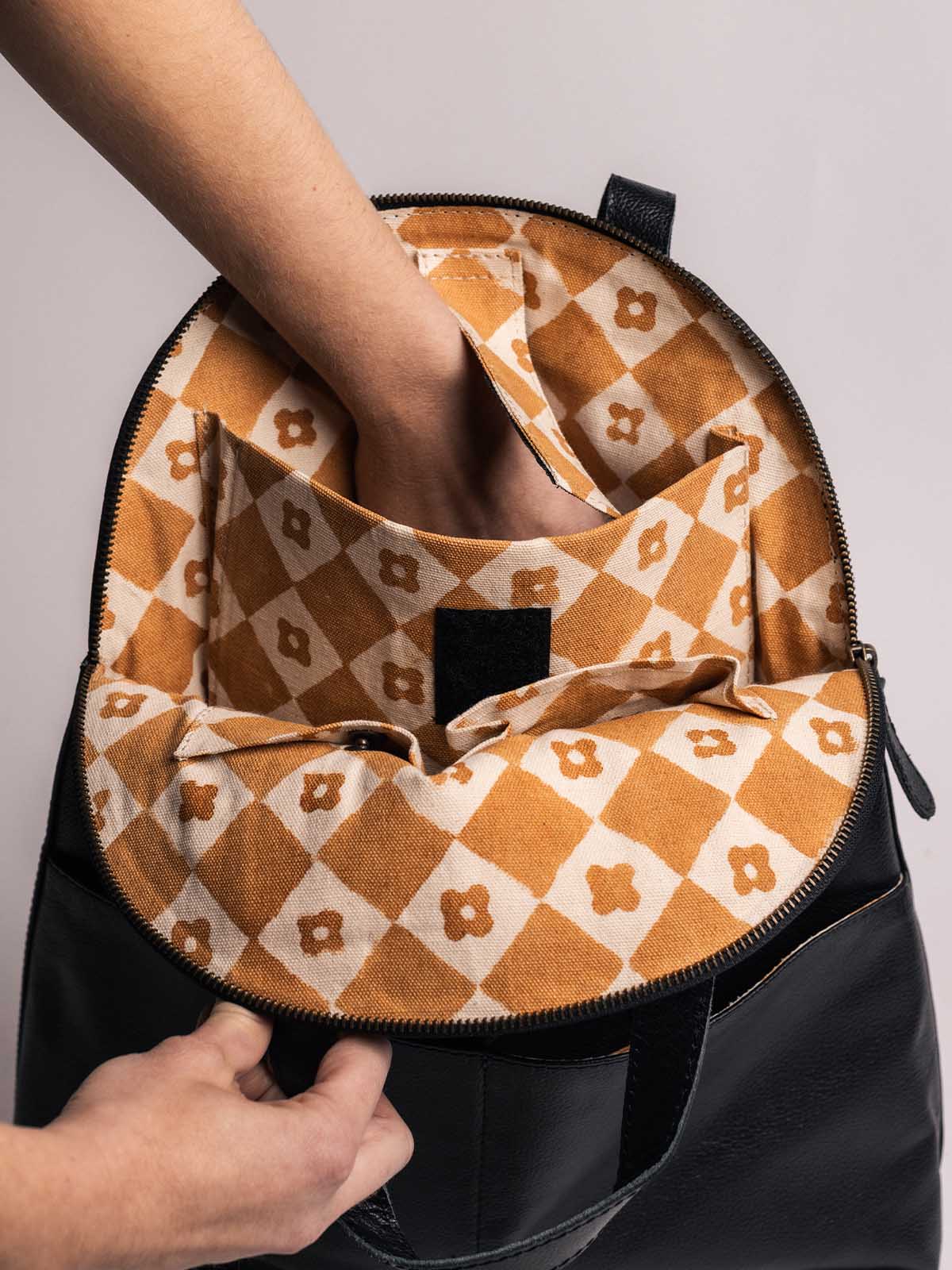 Pebbled Black Leather Half-Moon Backpack